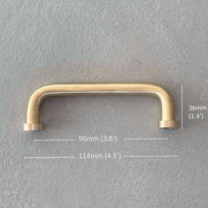 one rounded brass bar handle small size on grey background