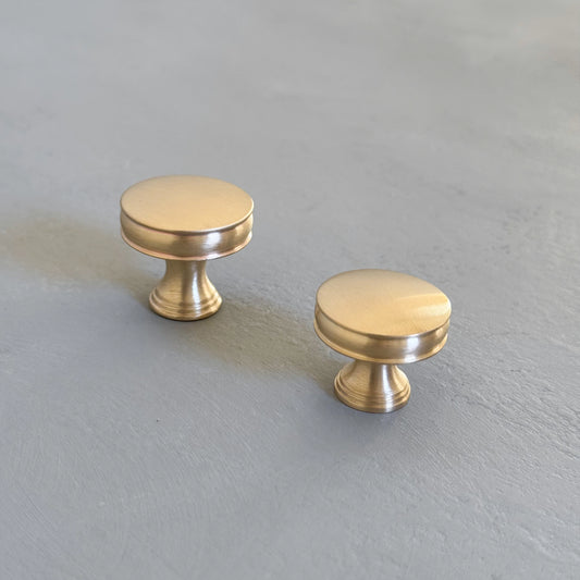 two bevel round knobs with grooves taken from right angle