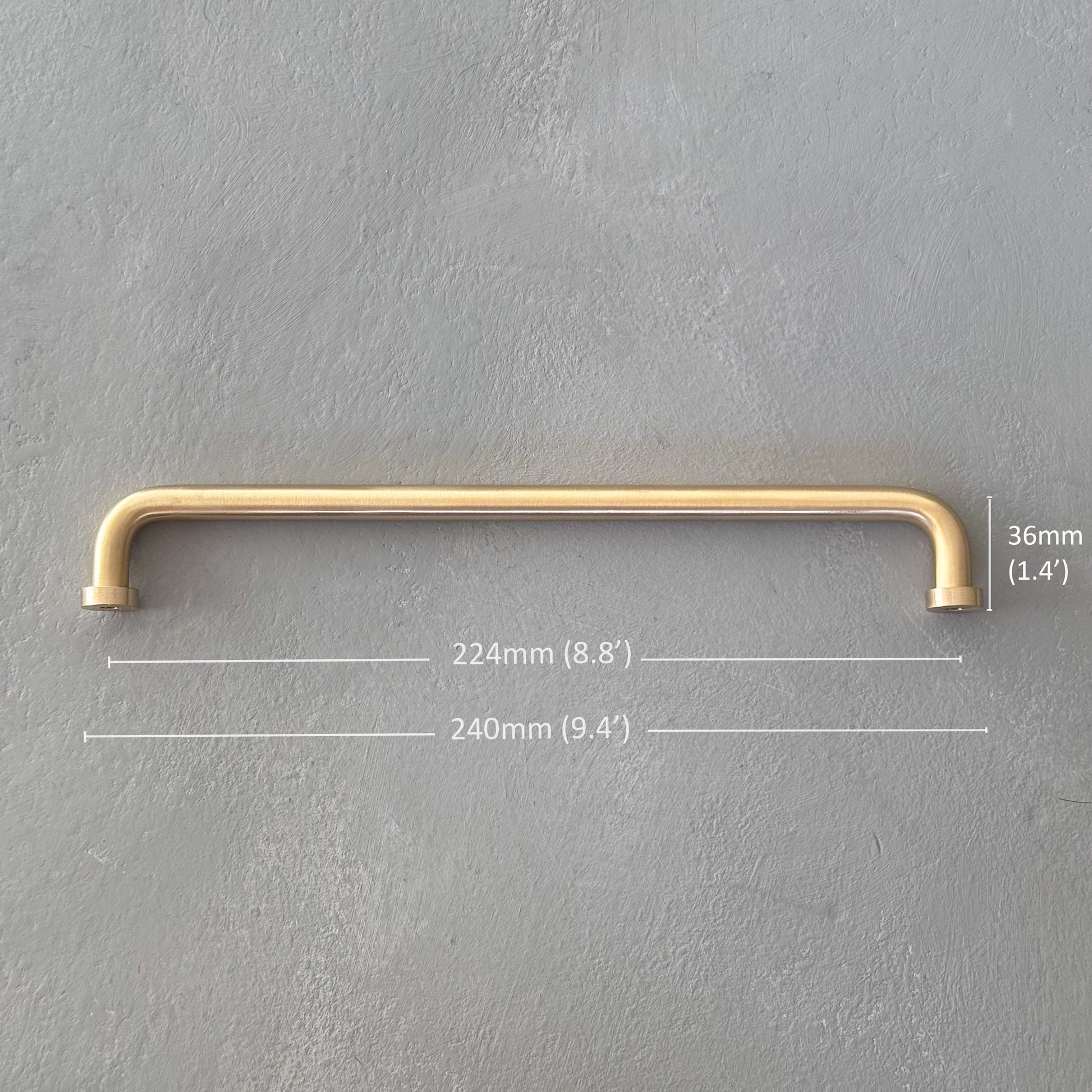 one rounded brass bar handle extra large size on grey background